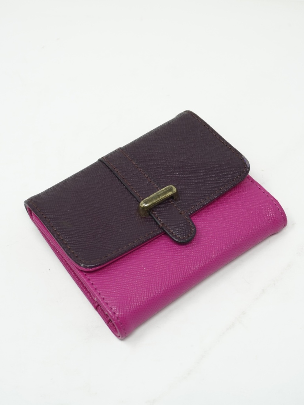 Cute small purple and pink bifold wallet features a textured finish